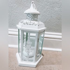 Ornate white metal lantern.